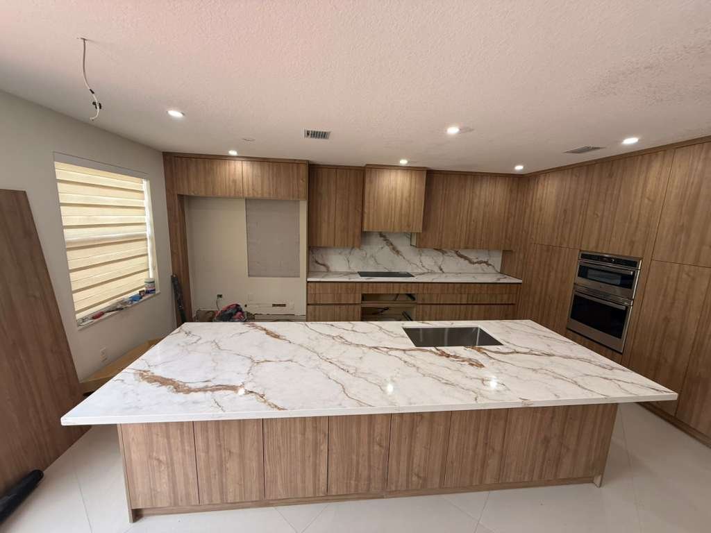 Warm wood custom kitchen with marble island